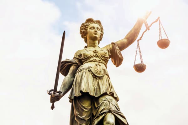 Justice statue with sunligh