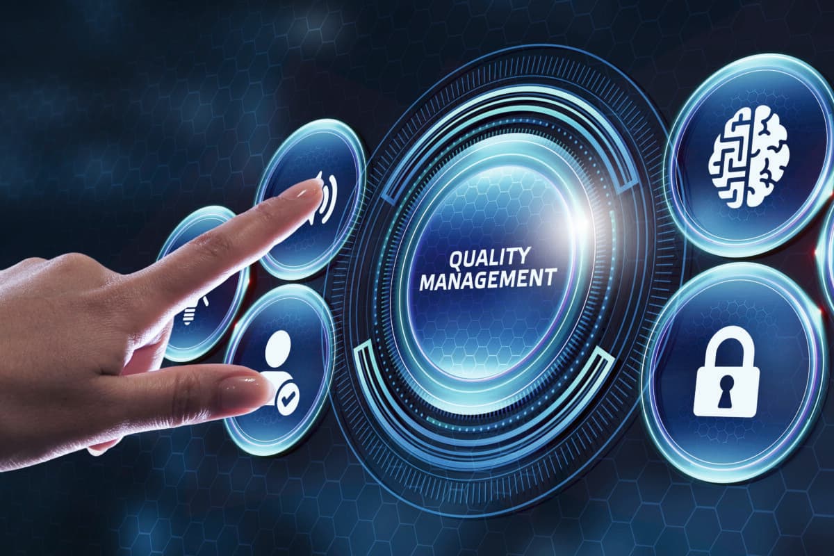 Businessman pressing quality management button on virtual screens. Business, Technology, Internet and network concept.